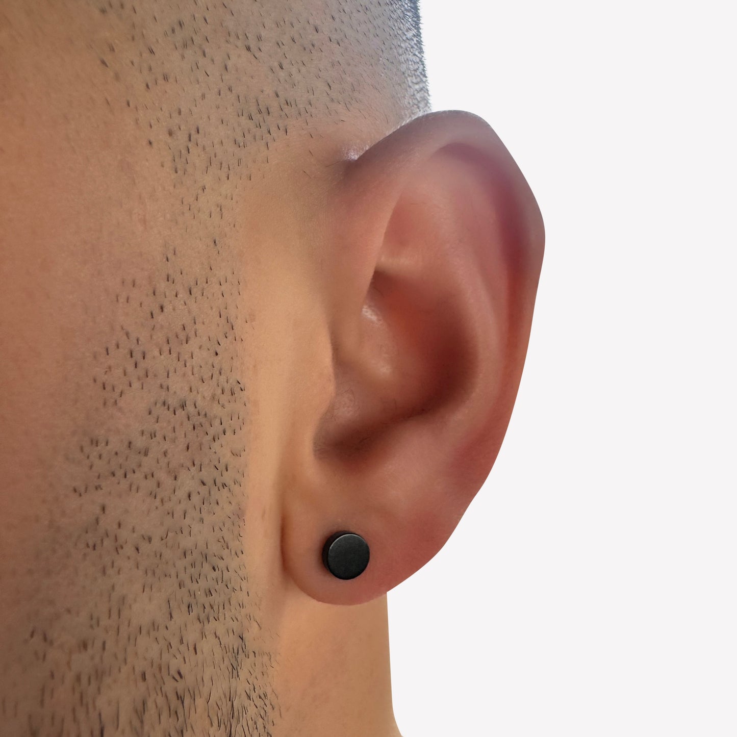 Black stainless steel faux stretcher stud earring – edgy design without actual stretching.